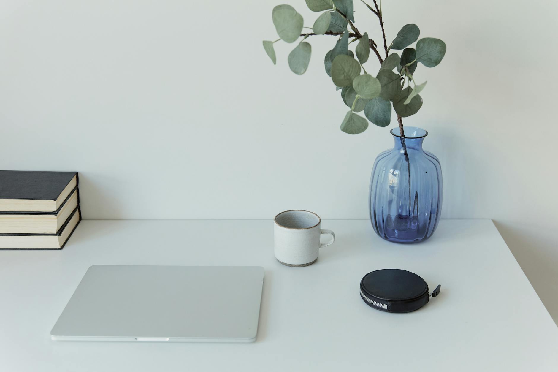 a minimalist workspace set up on white table